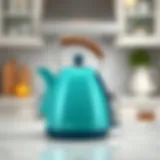 Elegant Teal Kettle Enhancing Kitchen Decor A modern teal kettle on a countertop