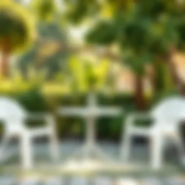 White plastic outdoor stacking chairs in a garden setting