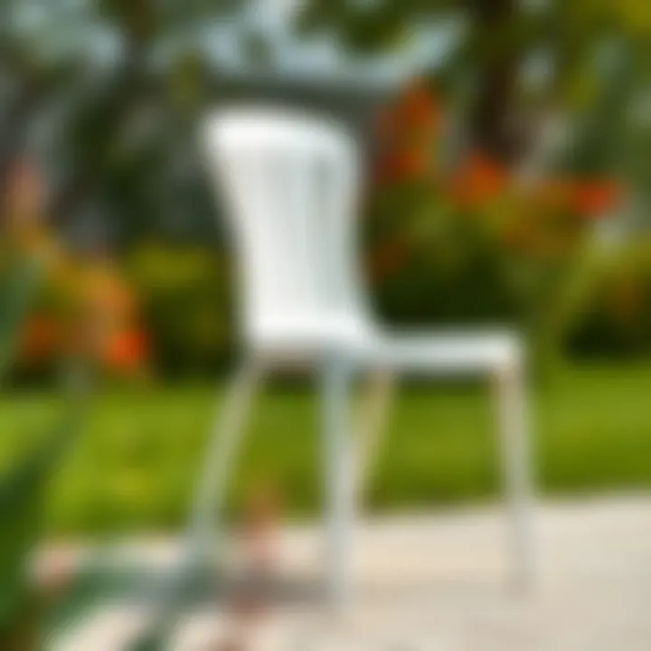 Innovative stacking mechanism demonstrated with white plastic chairs